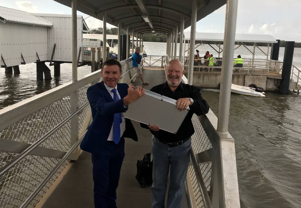 CAMERAS: Bowman MP Andrew Laming and Bay Islands Chamber of Commerce vice-president Colin McInnes with some of the CCTV equipment to be installed at bay island jetties. 