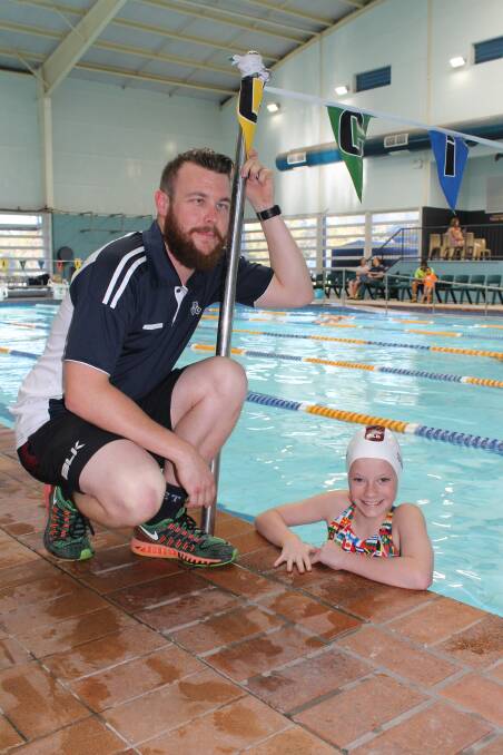 GREAT TEAM: Wellington Point Allstars Swim Club coach Brad Merson with Rylee Grier-Stralow. Photo: Cheryl Goodenough