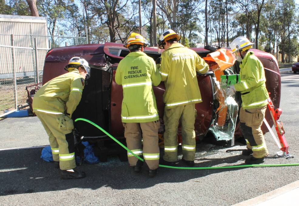 TRAINING: The Queensland Fire and Emergency Services Redlands rescue team training for the 2016 Australasian Road Crash Rescue Challenge. Photo: Cheryl Goodenough