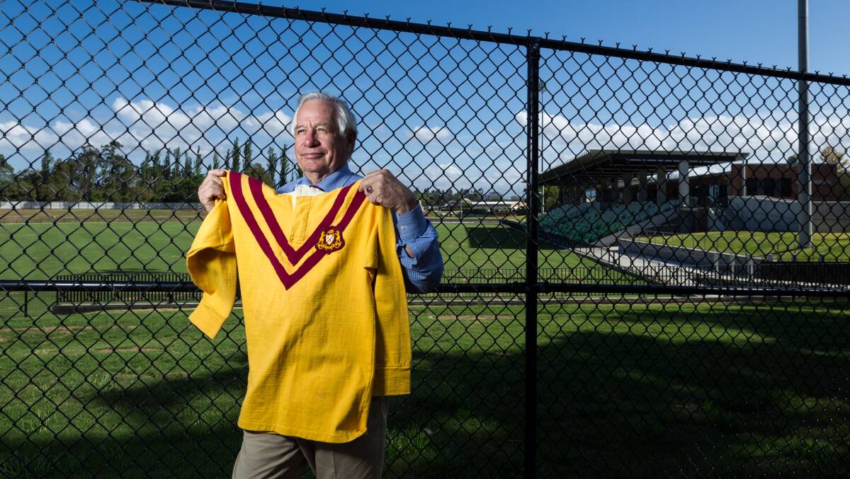 DIFFERENT TIMES: Brian Burke with a Country jumper he wore against Queensland at Newcastle before 25,000 fans. Picture: Max Mason-Hubers. 