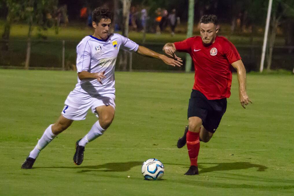 BATTLE FOR THE BALL:  Reldands player Alex Warrilow wins the battle for the ball during Redlands United  clash with Gold Coast United on Friday night in Cleveland. Picture: Ray Gardner.