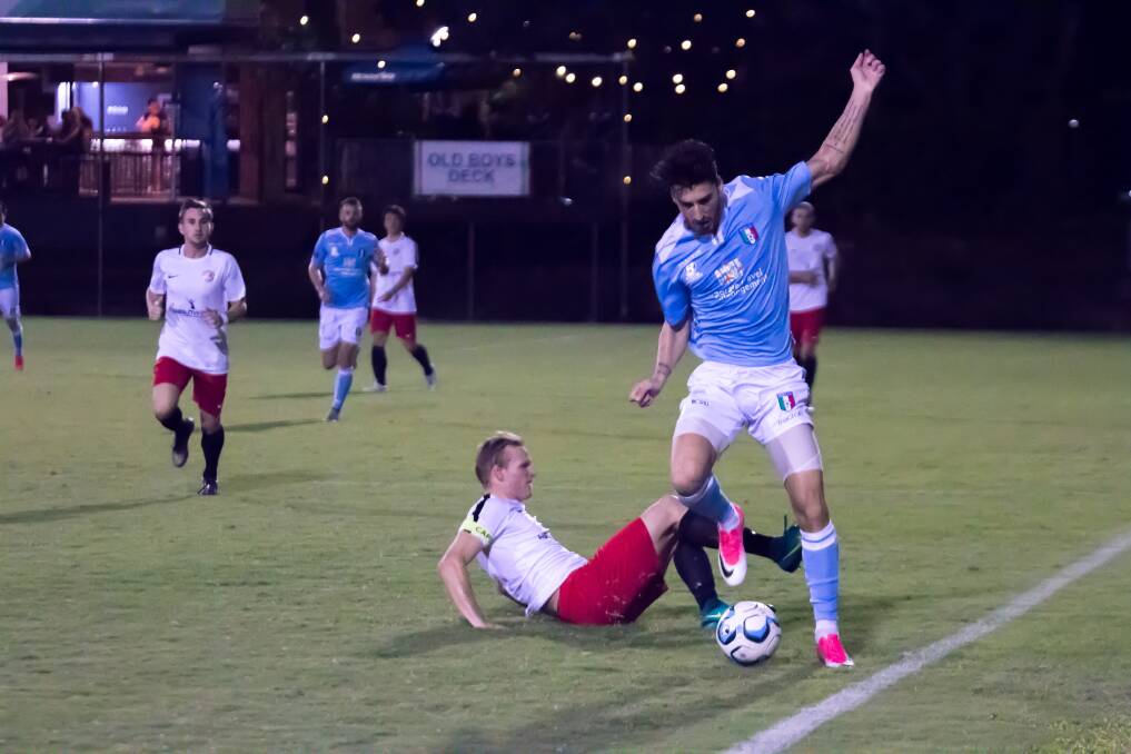 DEFENCE: Redlands United's Scott Bow slides in to make the tackle during the Red Devils' away NPL clash with Brisbane City last Saturday. Picture: Ray Gardner.