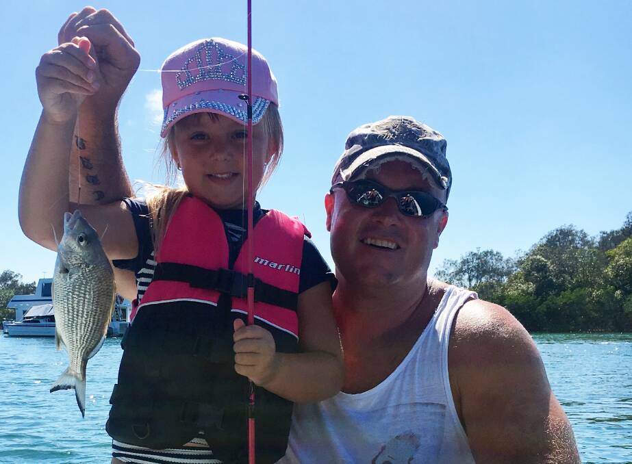 FIRST CATCH:  Young angler Piper McIntyre with her very first fish, a bream caught in the Tweed River at the weekend. Picture: Supplied 