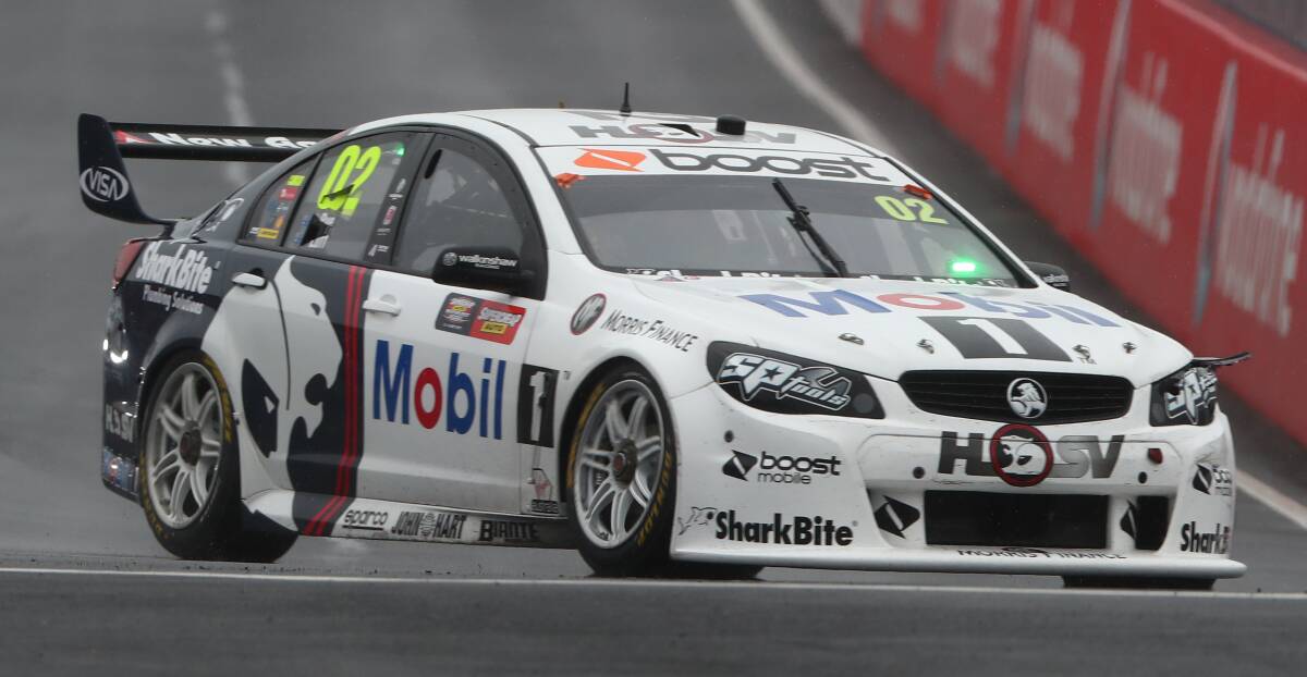 WHERE IT STARTED: Warren Luff swings his Walkinshaw Racing Commodore into Hell Corner during the opening lap of the Bathurst 1000. Photo: PHIL BLATCH