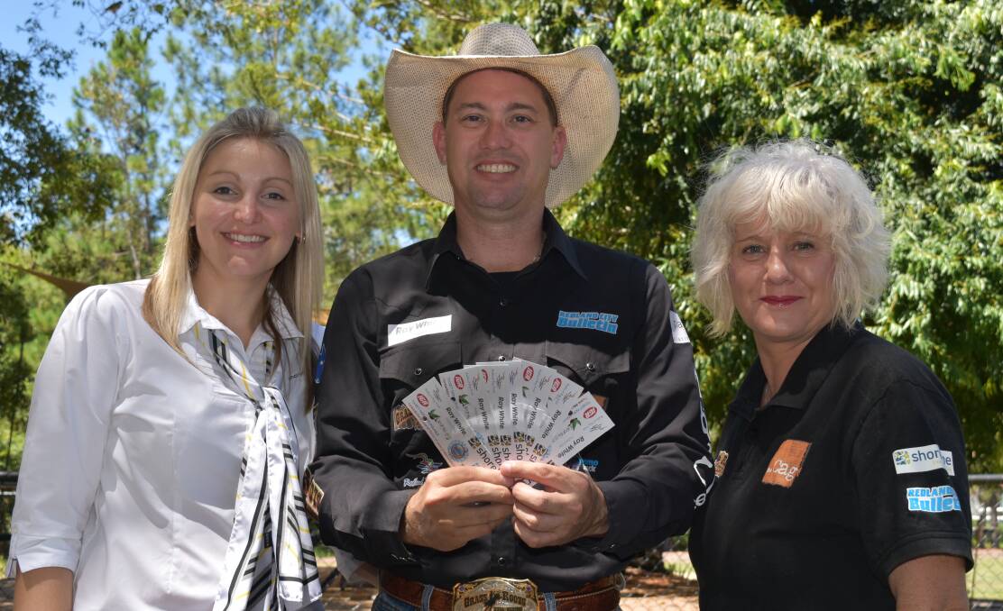 BULL RIDE: Redland Bay Ray White's Vanessa and Jesse James with Linda Grieve from The Cage Youth Foundation. Photo: Hannah Baker