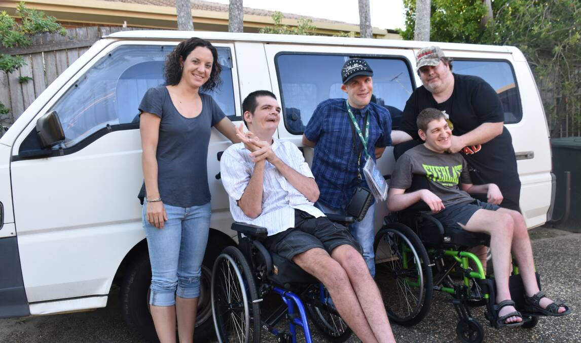 UPGRADE NEEDED: Carers Tammy Hunkin and Darren Ferguson (left and right) with Daniel Hoge, Nick Boult and Rowan Cooper. The old van is in the background. Photo: Hannah Baker