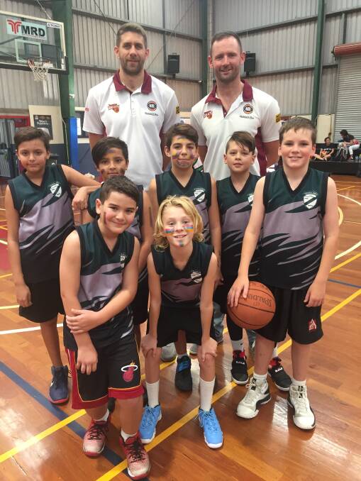 GREAT SUCCESS: Thornlands State School basketball players with Brisbane Bullets' team members Tom Jervis and Anthony Petrie. Photos: Supplied