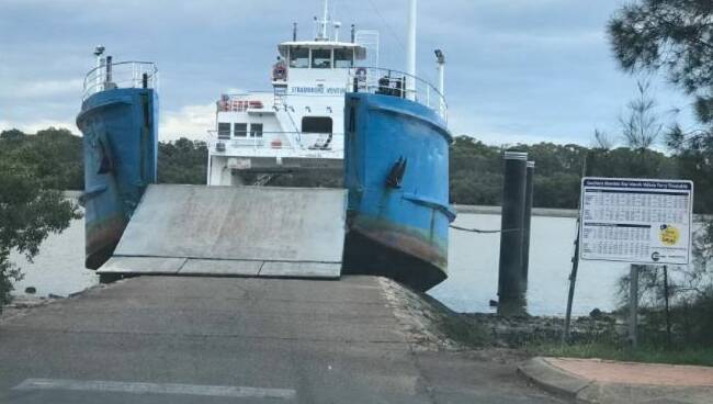 SERVICES SUSPENDED: A Stradbroke Ferries' barge was grounded at Russell Island's High Street ramp earlier this month, causing vehicle ferry services to be suspended there. Photo: Supplied