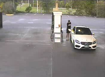 The man is caught on CCTV refueling the stolen Mercedes-Benz at a petrol station. Photo: Queensland Police Service