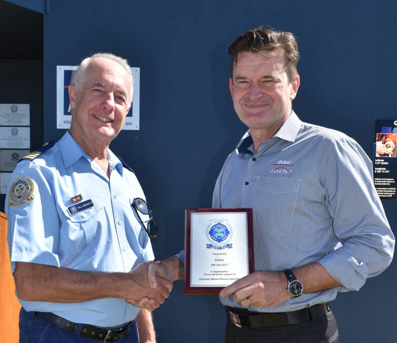 FRESH FACE LIFT: Raby Bay VMR Commodore Bill Bennett with Dulux Paint's Cameron Bell. Photo: Hannah Baker