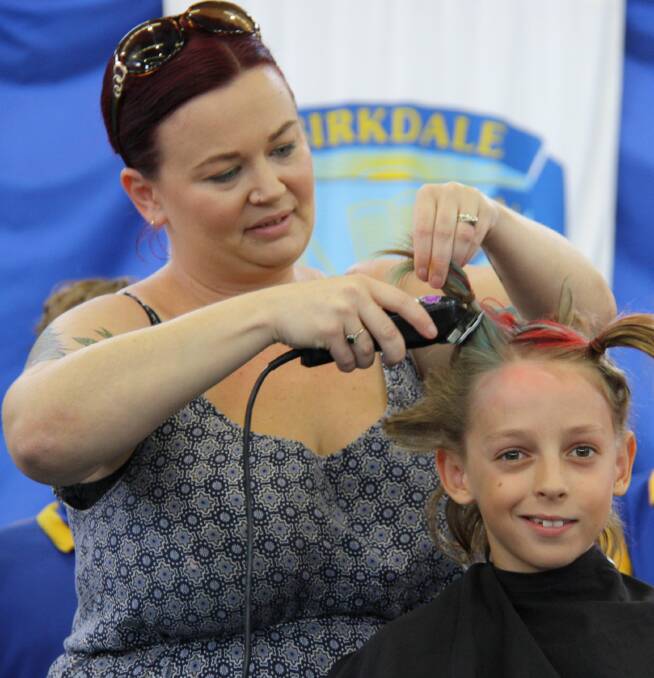 BEFORE: Birkdale State School student Steven Glass gets had his hair chopped for World's Greatest Shave. Photo: Supplied