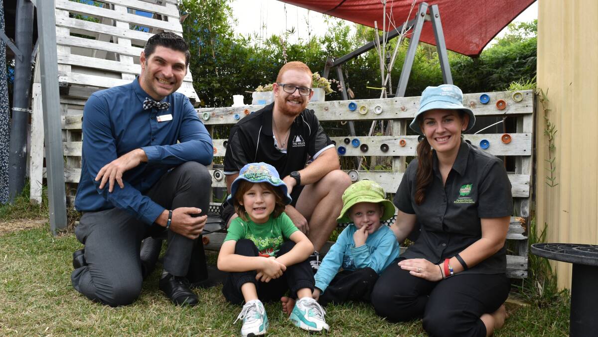 GREAT WORK: Pre-service teacher Benjamin Jackson pictured with state award nominees Jason Alexander, who is a kindergarten teacher, and Capalaba's Eskay Kids director Suzette Lageman with students Parker and Ethan. Photo: Hannah Baker