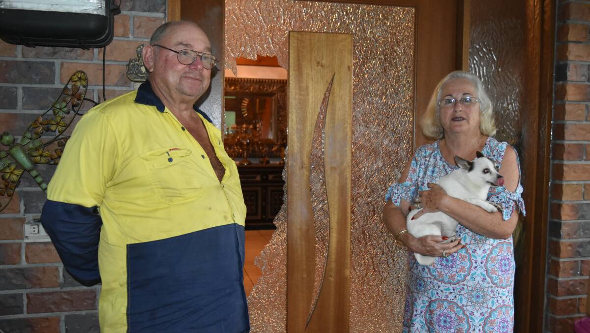 Henry and Sue Spierenburg stand outside their smashed front door. Photo: Hannah Baker