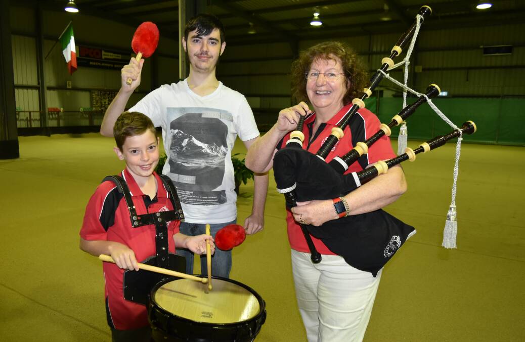 CELTIC FUN: Redlands Sporting Club pipe band drummers Blair Dodson, 11, and Cameron Rees, 19, with bagpipe player Sandra Capra. Photo: Hannah Baker