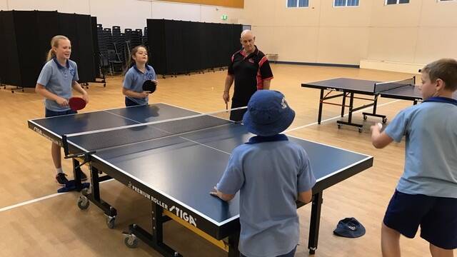 SPORTING FUN: Children at Redland Bay State School enjoy games of table tennis as part of the Tops program.