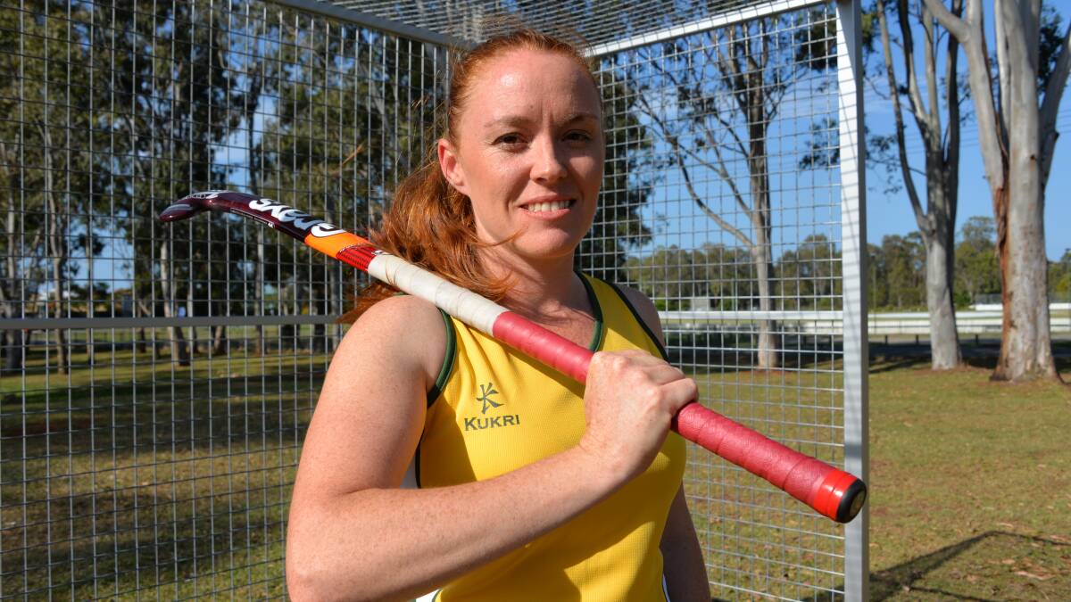 HOCKEY STAR: Wellington Point woman Kylie O'Donohue wearing the green and gold Australian team uniform.