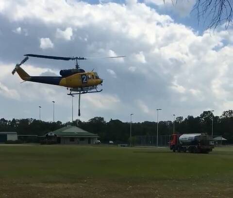 VIDEO GRAB: A chopper lands at Henry Ziegenfusz Park along Fitzroy Street, with a fuel tanker parked nearby. Photo: Supplied