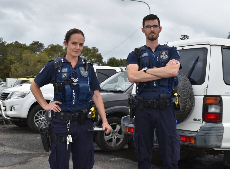 THEFT PREVENTION: Redland Bay station's Senior Constable Peta Bell and Constable Ben Clinch want island commuters to keep their cars locked and remove valuables when parked on the mainland. Photo: Hannah Baker