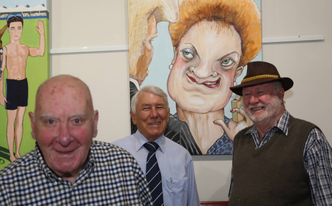 CONVERSATION: Encouraging conversation is the Bald Archies at the Grand View. Chatting about this caricature of Pauline Hanson is exhibition coordinator  Peter Batey, hotel owner Gerald Brock and artist Ed McMahon.