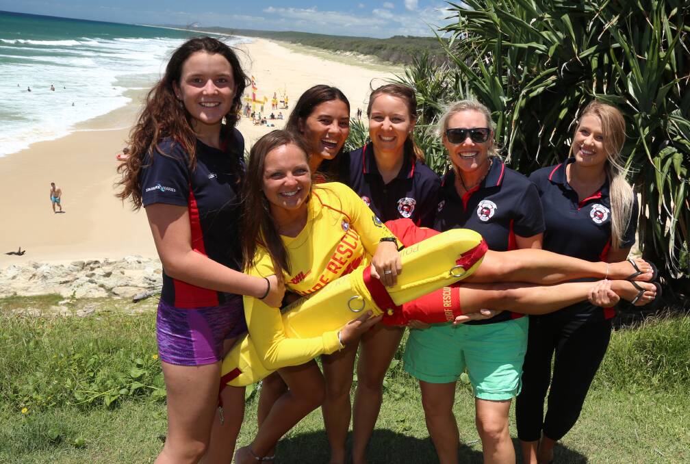FRIENDS: Surf girl Sam Lavery has fun with fellow lifesavers Libby Muller of Victoria Point, Olivia Hamanne, Ann-Sophie Sullivan, Emma Meyer, and former surf girl entrant for Mackay Laura Zambon.