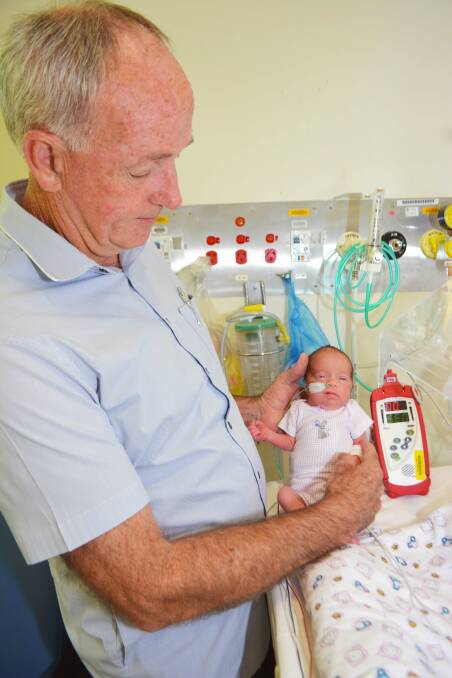 DONATED: Pulse Oxymeters are essential equipment at the Redland Hospital Special Care Nursery according to midwife Ray Doro, pictured with baby Ayla.