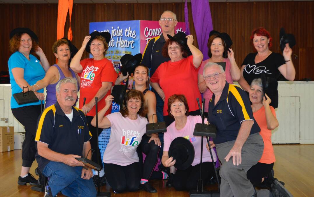 TO LIFE:Here’s to Life dancers get together with the men from the Redland Bay Men’s Shed.  The men assisted in creating props for a concert being staged on September 17.  