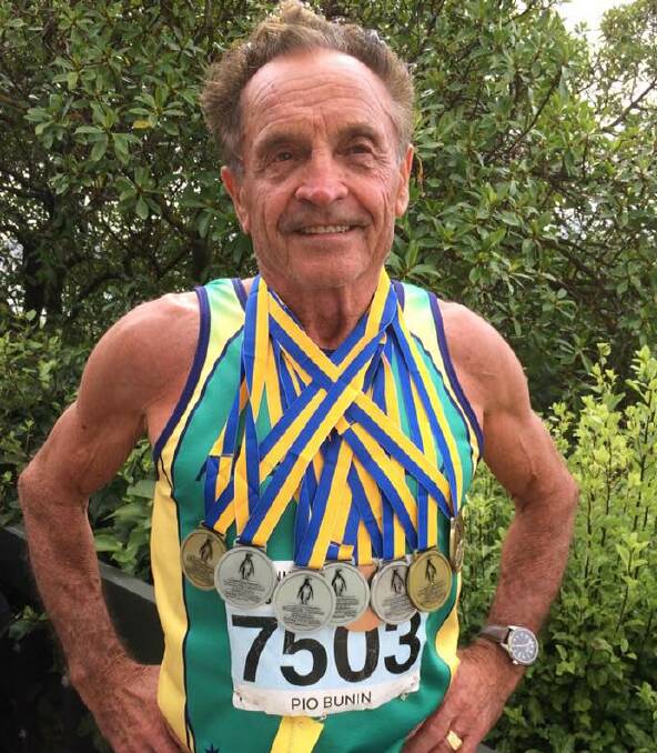 WINNER: Pio Bunin, 77, shows his master's medals, gained recently in New Zealand.