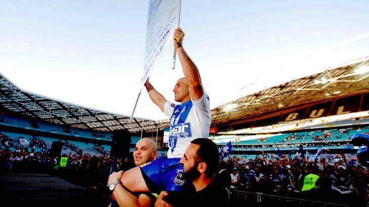 Club legend: Bulldogs stalwart Hazem El Masri is chaired off the field in his farewell game at ANZ Stadium in 2009. Photo: Steve Christo