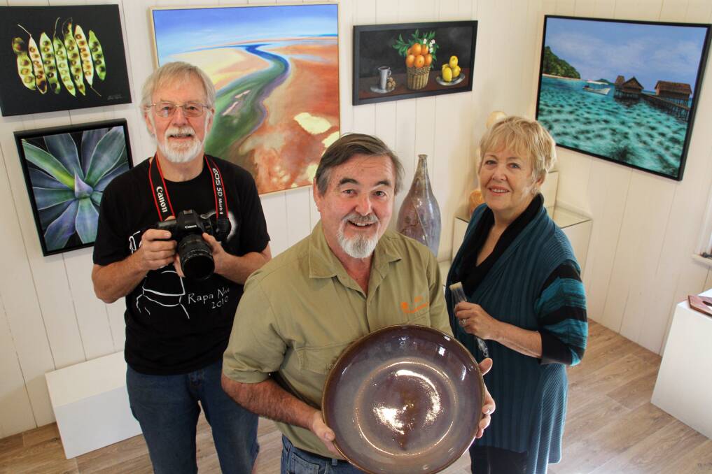 Photographer Phil Robinson, potter Paul Holland and painter May Sheppard will exhibit their work at the Old Schoolhouse Gallery throughout August. Photo by Chris McCormack