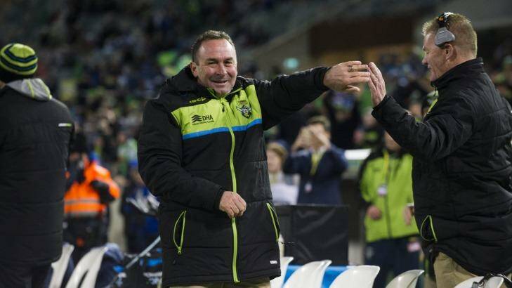 Raiders' coach Ricky Stuart celebrates the final try with assistant coach Mick Crawley. Photo: Rohan Thomson