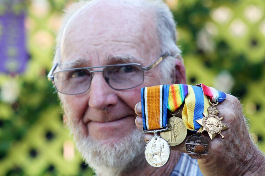 Jim Bernard of Victoria Point with medals that belonged to his late father, who served at Gallipolli in World War I. Jim will attend the Centenary of Anzac service at Gallipoli.  
Photo by Chris McCormack