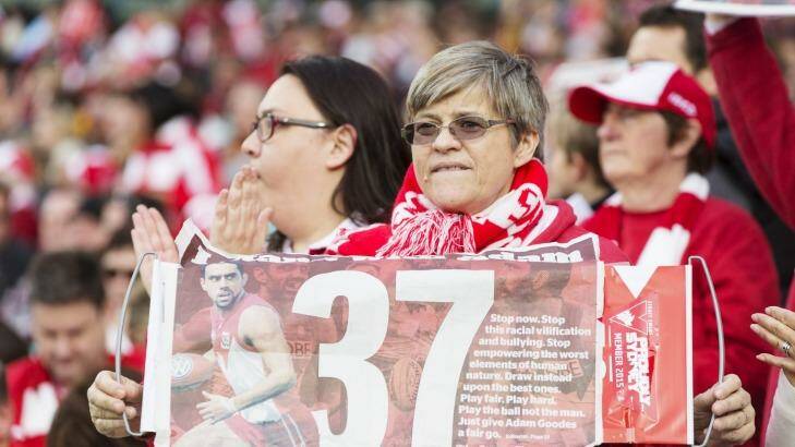 Fans support Adam Goodes with the Fairfax poster. Photo: James Brickwood