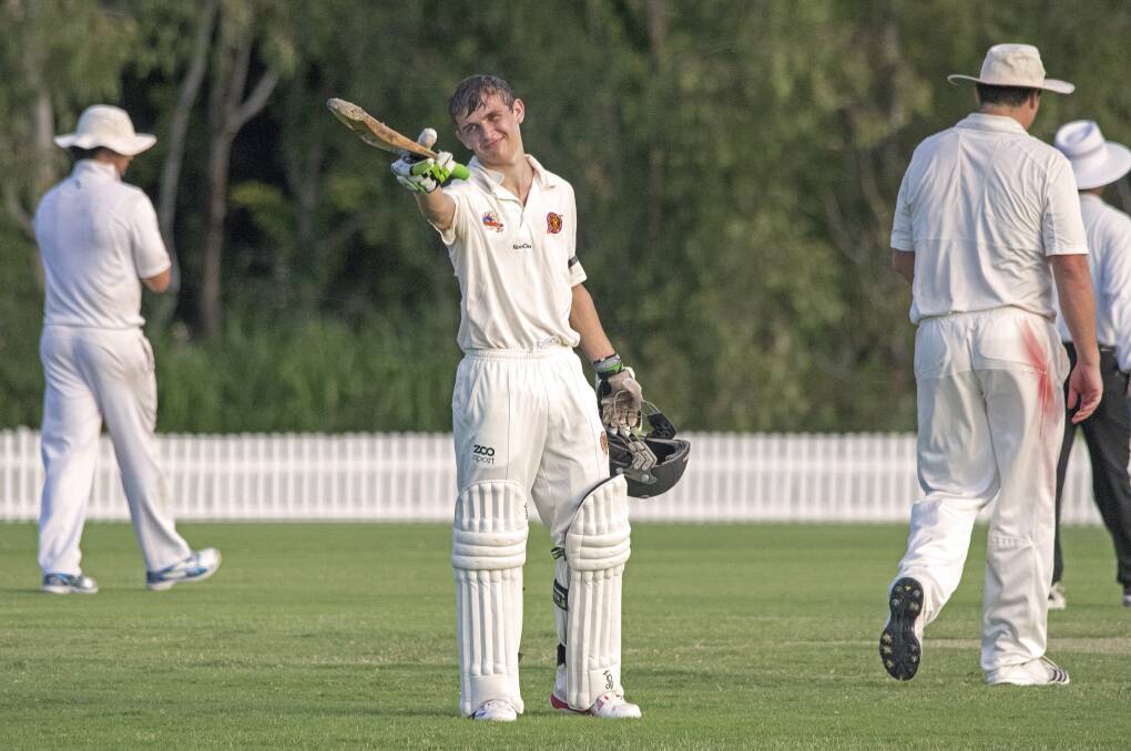 Redlands player Mitch Carrigan raises his bat after scoring a century in the 5th grade game played against Wynnum at Wellington Point last Sunday.
Photo by Doug O’Neill
