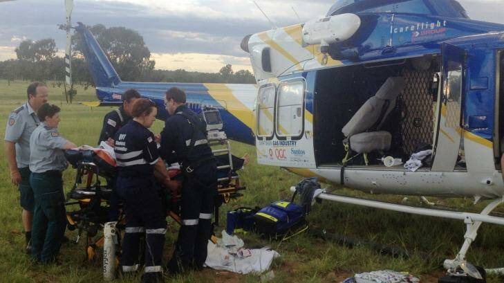 The Surat Gas Aero-Medical helicopter team takes a man to Toowoomba Hospital after a suspected quad bike rollover Photo: Supplied