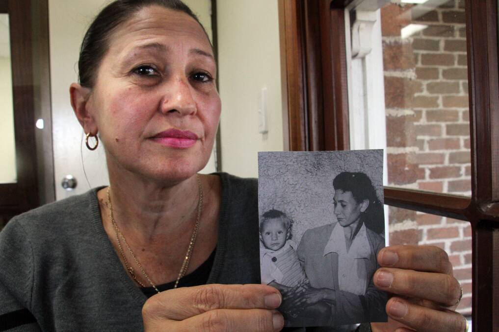 Australia's National Day of Healing is an important time for Margie Kennedy, pictured with a photo of her mother and brother who were part of the Stolen Generations.  
Photo by Chris McCormack