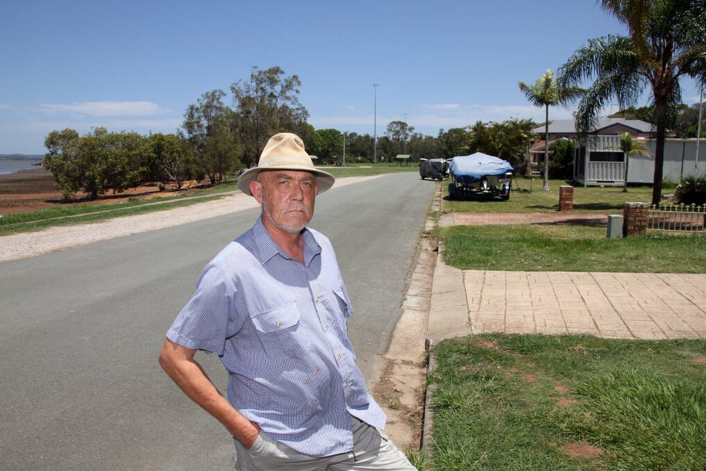 Esplanade, Redland Bay resident Ted Wearne is concerned a container on neighbouring land could be a hazard in a storm.Photo by Chris McCormack