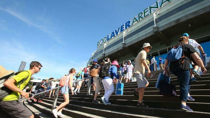 Tennis fans  rush into Rod Laver Arena on the first day of the Australian Open on Monday. Photo: Graham Denholm