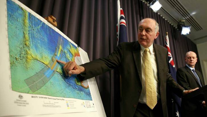Deputy Prime Minister Warren Truss shows the search zone for MH370 during a press conference in June 2014.  Photo: Alex Ellinghausen