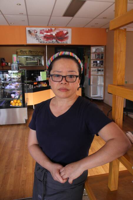 Bay Breeze Cafe owner Jenny Tan was robbed while being distracted by con-artists. 
 
Photo by Chris McCormack