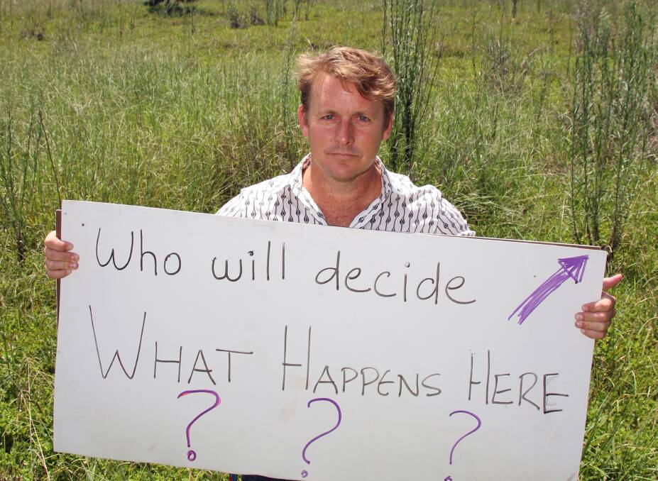 Councillor Paul Bishop poses the question of who will decide on the fate of a Birkdale block of land. 
 Photo by Chris McCormack