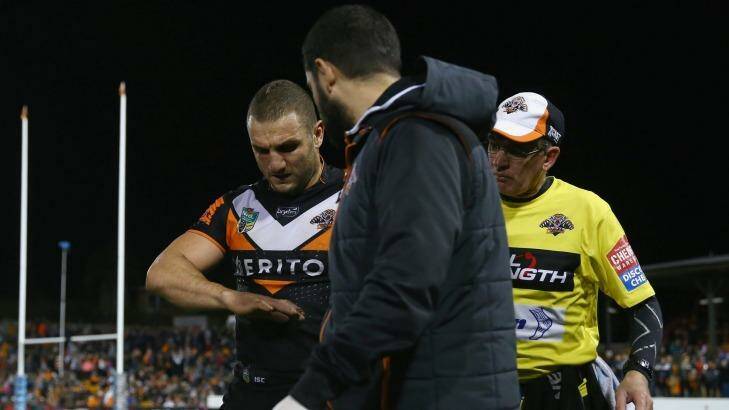 Broken: Robbie Farah leaves the field with an injured hand against Penrith on Sunday. Photo: Getty Images 