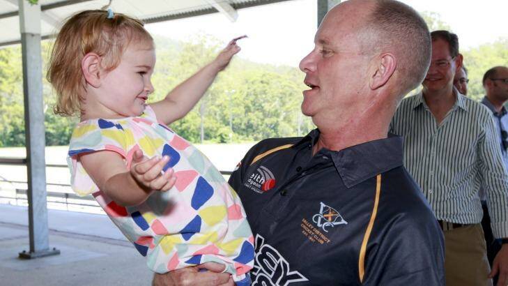 Premier Campbell Newman meets a young local in Ashgrove.