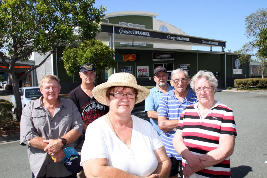 Victoria Point residents (from left) Ray Dunn, Martin Sealy, Maria Sealy, Clarence Cooke, George Speight and Dorn Sullivan, have objected to proposed extended trading hours at Victoria Point Tavern. Photo by Chris McCormack