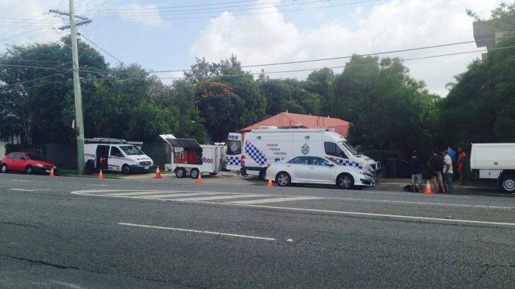 Police at the scene of a suspected stabbing murder at Highgate Hill. Photo: Kim Stephens