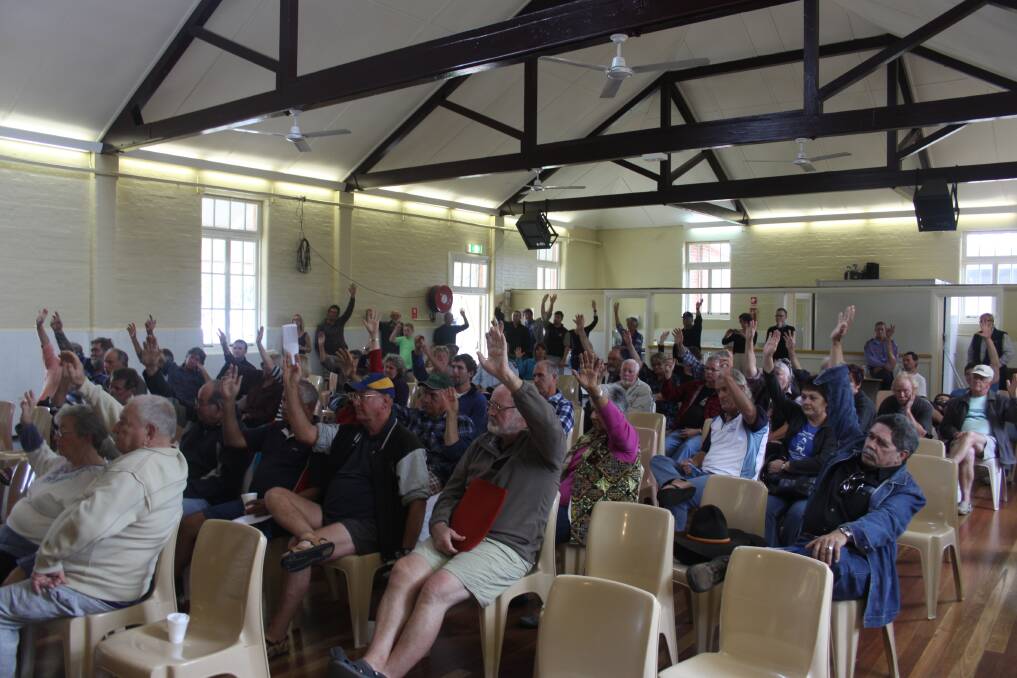 Straddie residents vote in favour of creating a rural fire brigade on the island at a public meeting in Dunwich on Saturday. Photos by Stephen Jeffery