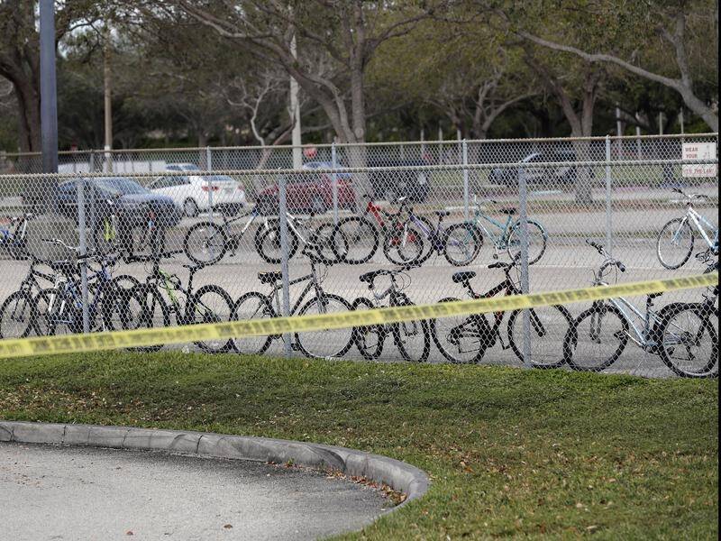 Bicycles abandoned by students at a Florida high school when 17 people died in a mass shooting.