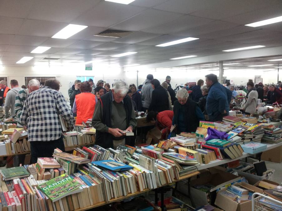 Bargain hunters at the Rotary Club giant garage sale to raise funds for drought-stricken farmers.