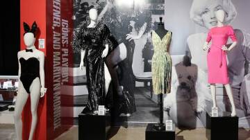 A pink Pucci dress worn by Marilyn Monroe (r) has sold for half a million dollars. (EPA PHOTO)