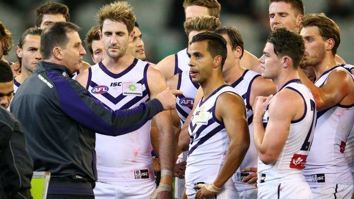 MELBOURNE, AUSTRALIA - JUNE 24:  Danyle Pearce of the Dockers, Michael Barlow and the Dockers listen to Ross Lyon, coach of the Dockers speak during a quarter time break during the round 14 AFL match between the Collingwood Magpies and the Fremantle Dockers at Melbourne Cricket Ground on June 24, 2016 in Melbourne, Australia.  (Photo by Scott Barbour/Getty Images) Photo: Scott Barbour