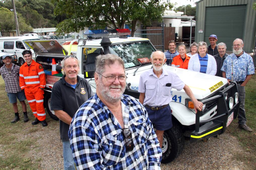 North Stradbroke Island Rural Fire Brigade secretary Jim Hemsley, first officer Allen Chaplin and second officer Greg Litherland with the new fire truck.  
Photo by Chris McCormack